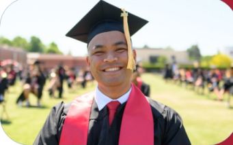 Male-graduate-posing-for-photo-in-cap-and-gown