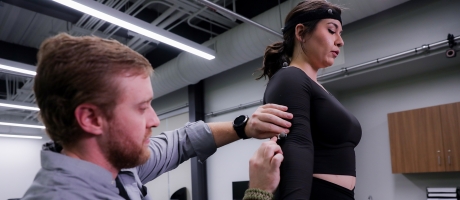 UHCL staff measuring an individual to determine motion capture