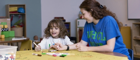 Student teach and student in class