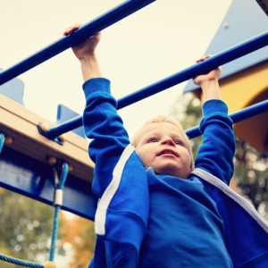 Child on monkey bars