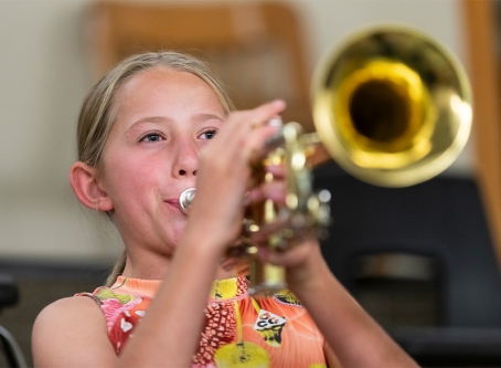 middle school student playing the trumpet