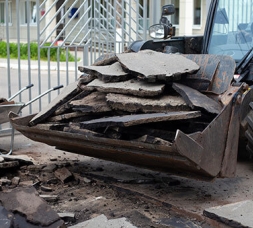 Skidsteer bucket full of concrete