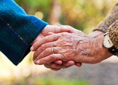 elderly hand holding image