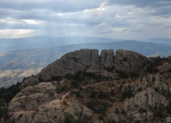 Sun shining on large rock