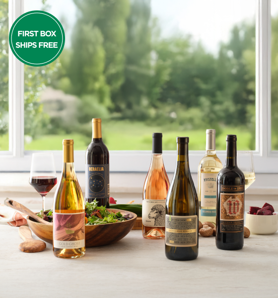 Couple in kitchen drinking firstleaf wine while eating
