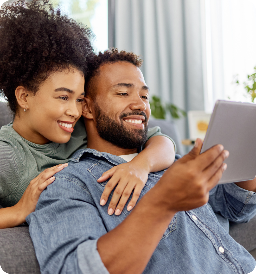 Couple Smiling using tablet