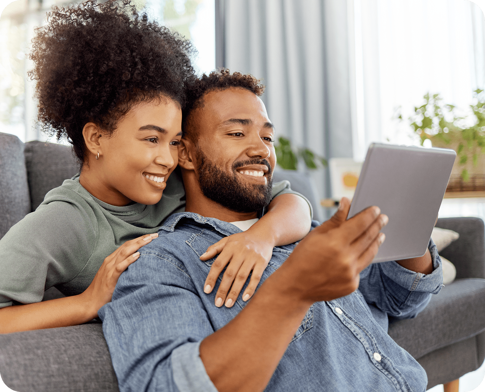 Young Couple browsing safely on a tablet device using Aura