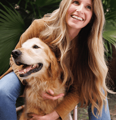 woman and golden retriever