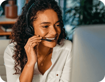 Lady answering call to give best in class fraud support smiling