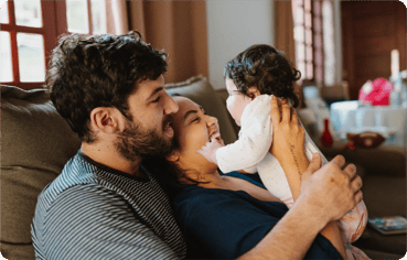 Young family on couch at home