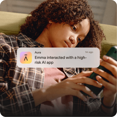 Kid using phone. Aura notification says Emma interacted with a high-risk AI app.