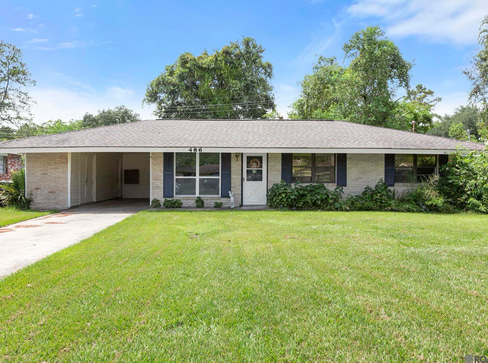Single-story home with visible exterior wear, ideal for a fixer-upper purchase.