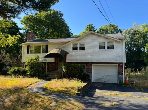 Single-story home with visible exterior wear, ideal for a fixer-upper purchase.