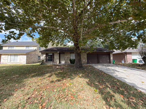 Older single-story home with worn exterior, suitable for renovation or cash purchase.