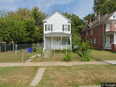Single-story home with dated exterior and minimal landscaping, ideal for a fixer-upper sale.