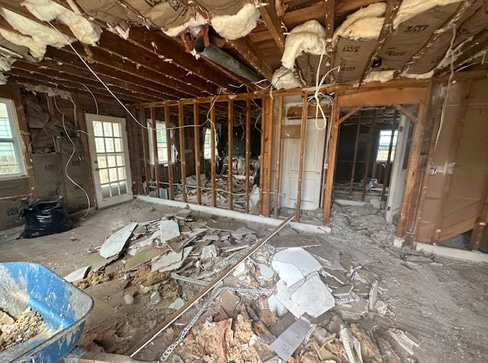 Single-story home with visible exterior wear, ideal for a fixer-upper purchase.