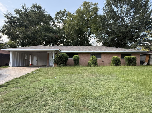 Older single-story home with worn exterior, suitable for renovation or cash purchase.