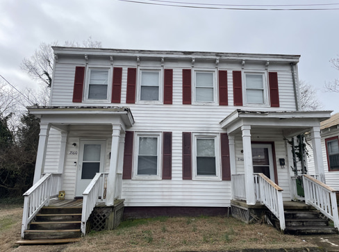 Older single-story home with worn exterior, suitable for renovation or cash purchase.
