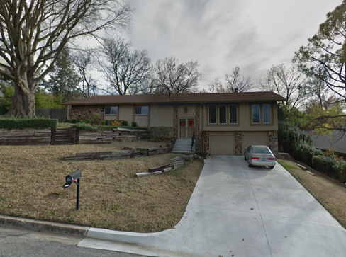 Older single-story home with worn exterior, suitable for renovation or cash purchase.