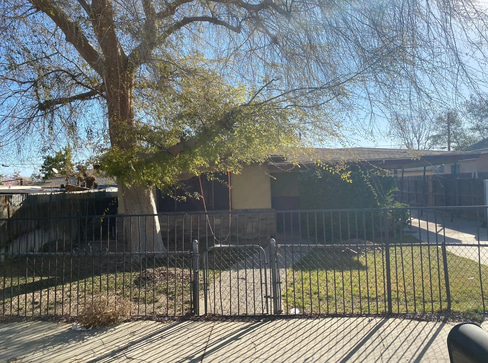 Single-story home with visible exterior wear, ideal for a fixer-upper purchase.