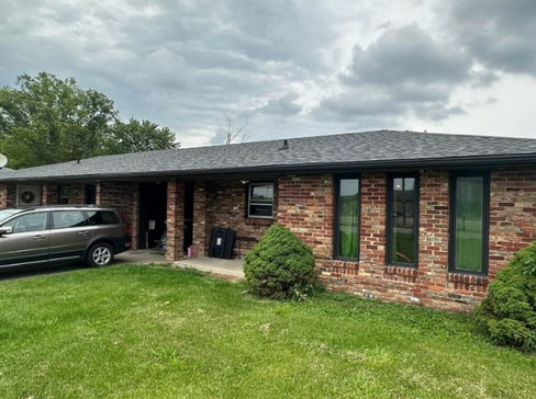 Single-story home with visible exterior wear, ideal for a fixer-upper purchase.