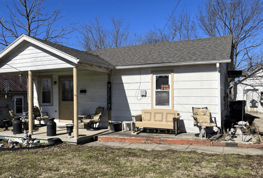 Single-story home with visible exterior wear, ideal for a fixer-upper purchase.