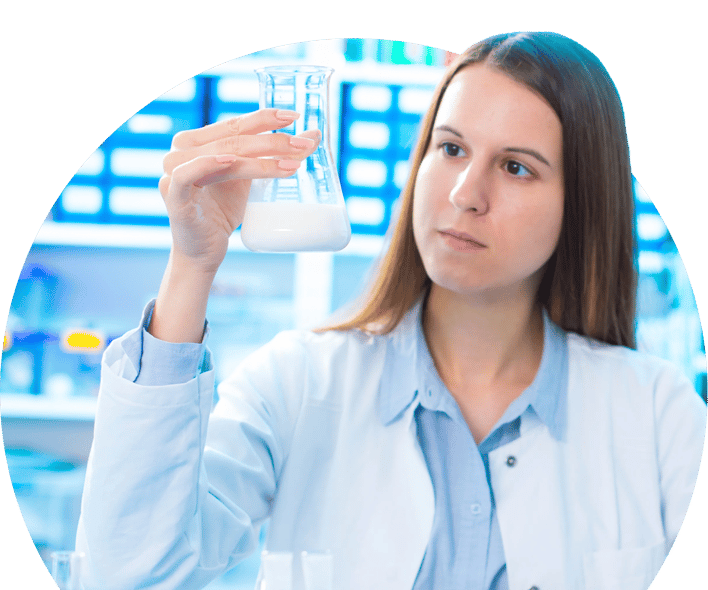 Scientist looking at beaker
