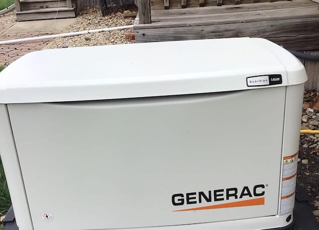 Professional exterior installation of a Generac residential backup generator.