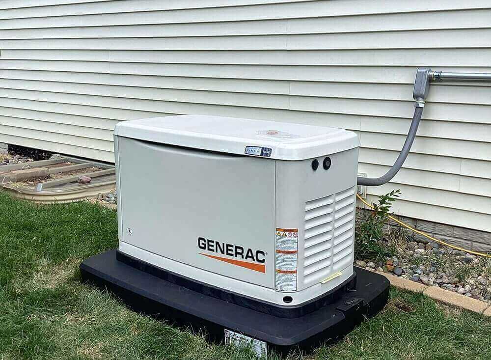 Professional exterior installation of a Generac residential backup generator.
