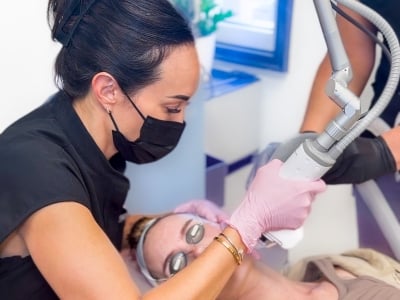 patient receives laser facial treatment at monument med spa