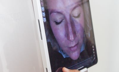 patient face on an ipad during a skin analysis consult