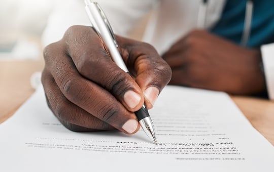 Doctor filling out a form