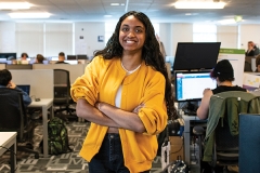 Confident female student with arms crossed
