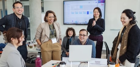 Executive Education faculty and students working together