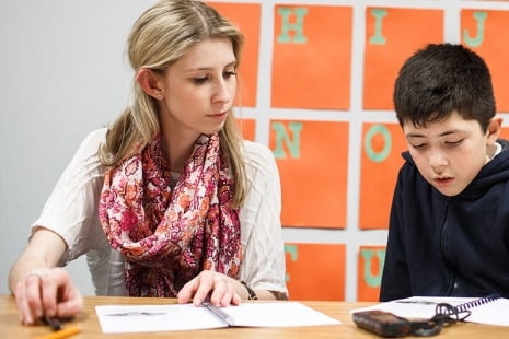 Female counselor helping a young student