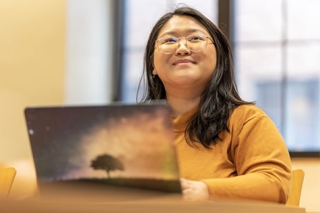 Marquette student at her laptop