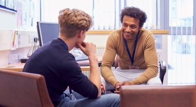 Counselor talking with a young man