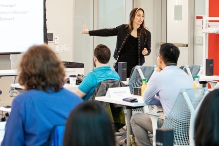 Teacher in front of class giving a lecture