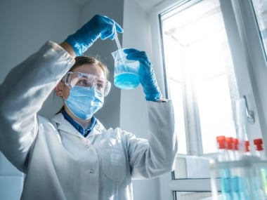 Close-up of female engineer working with test sample.