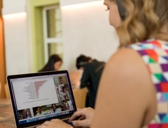 Woman on her laptop in a virtual meeting