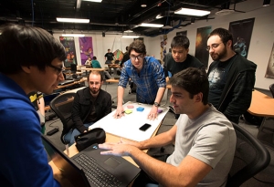 group of male students in a huddle