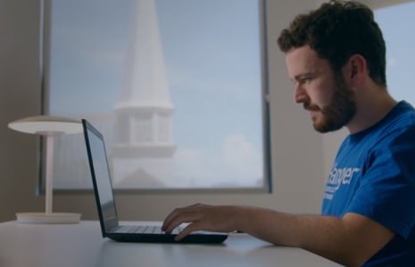 Image of student on computer in early career