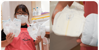 向加奈恵先生がPampersシリーズのおむつを持っている画像