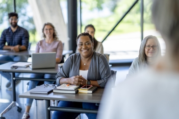 HR professionals at an in-person seminar led by an instructor