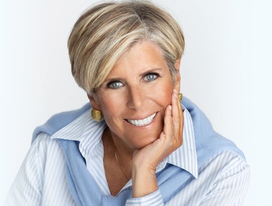 Photo of Suze Orman wearing a blue and white striped shirt