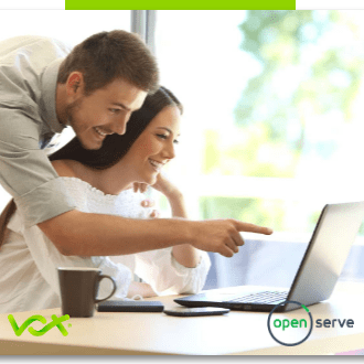 A college teacher instructing his student on her laptop