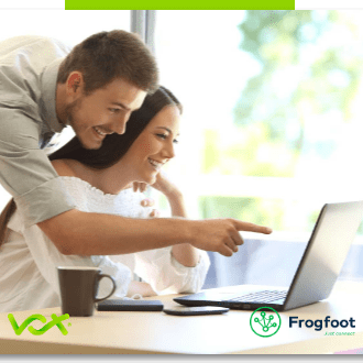 A teacher showing a student how to solve a maths question