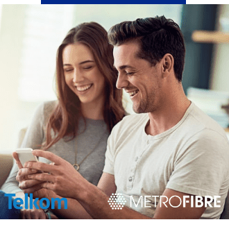 A couple streaming their favourite music on their mobile phone