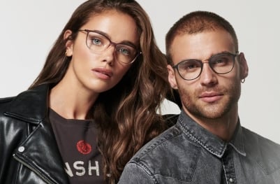 A man and a woman wearing high-quality prescription glasses from Dynamic Vision Optometrists.