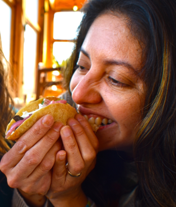 Woman eating a taco